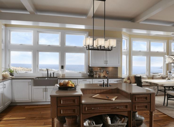 Bright kitchen with wide glass windows framing an ocean view and sky, Ventura, CA