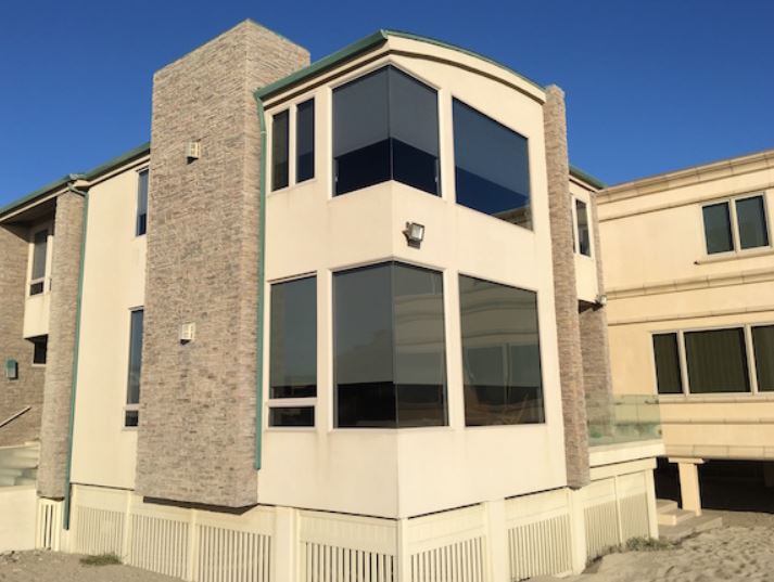 Exterior view of multi-story building with wide glass windows, replacement windows Ventura, CA