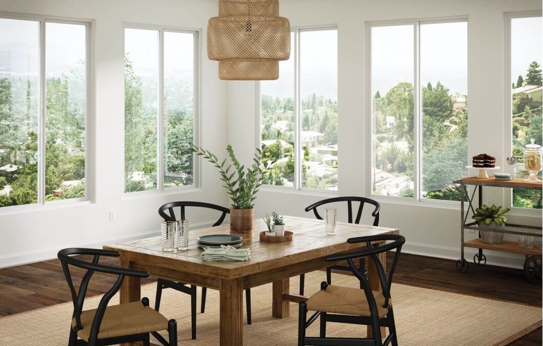 Large fitted windows brighten a dining room and frame scenic views in Ventura, CA.