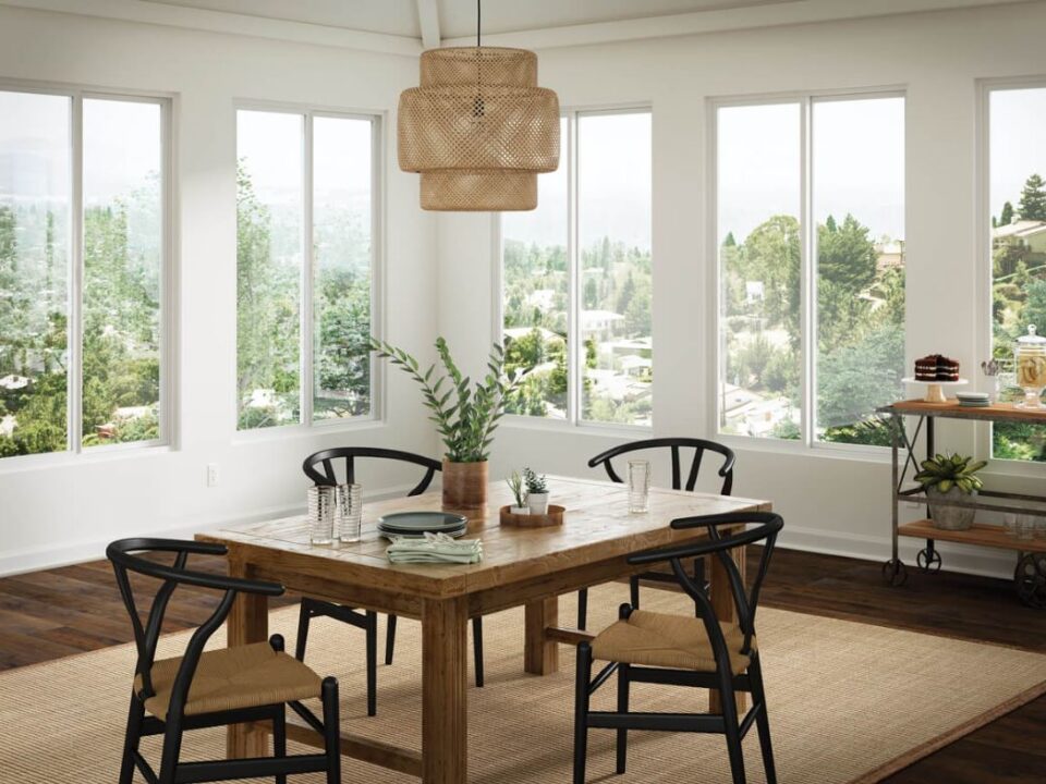 Large fitted windows brighten a dining room and frame scenic views in Ventura, CA.