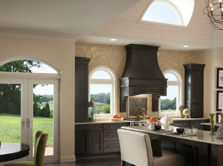Arched vinyl windows brighten a spacious kitchen while supporting comfort in Simi Valley, CA.