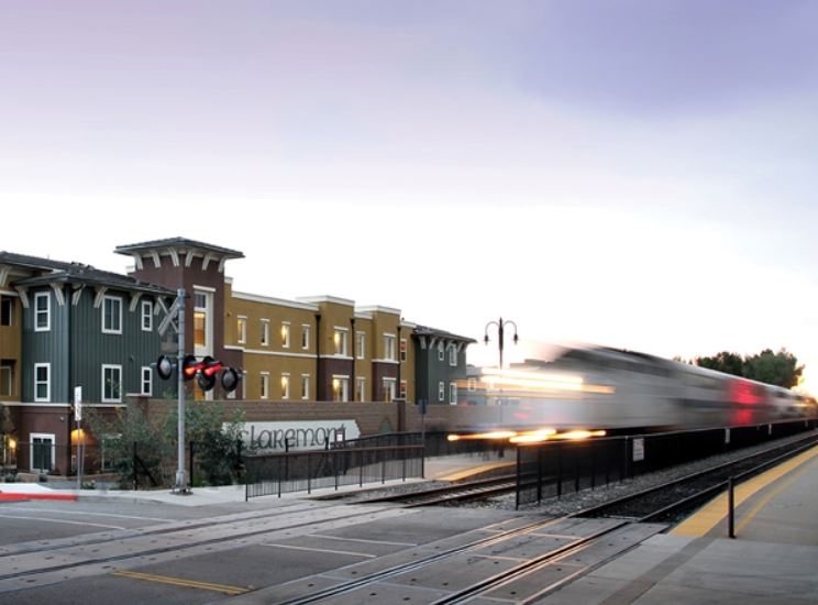 Modern building windows line a busy rail crossing, replacement windows Simi Valley, CA
